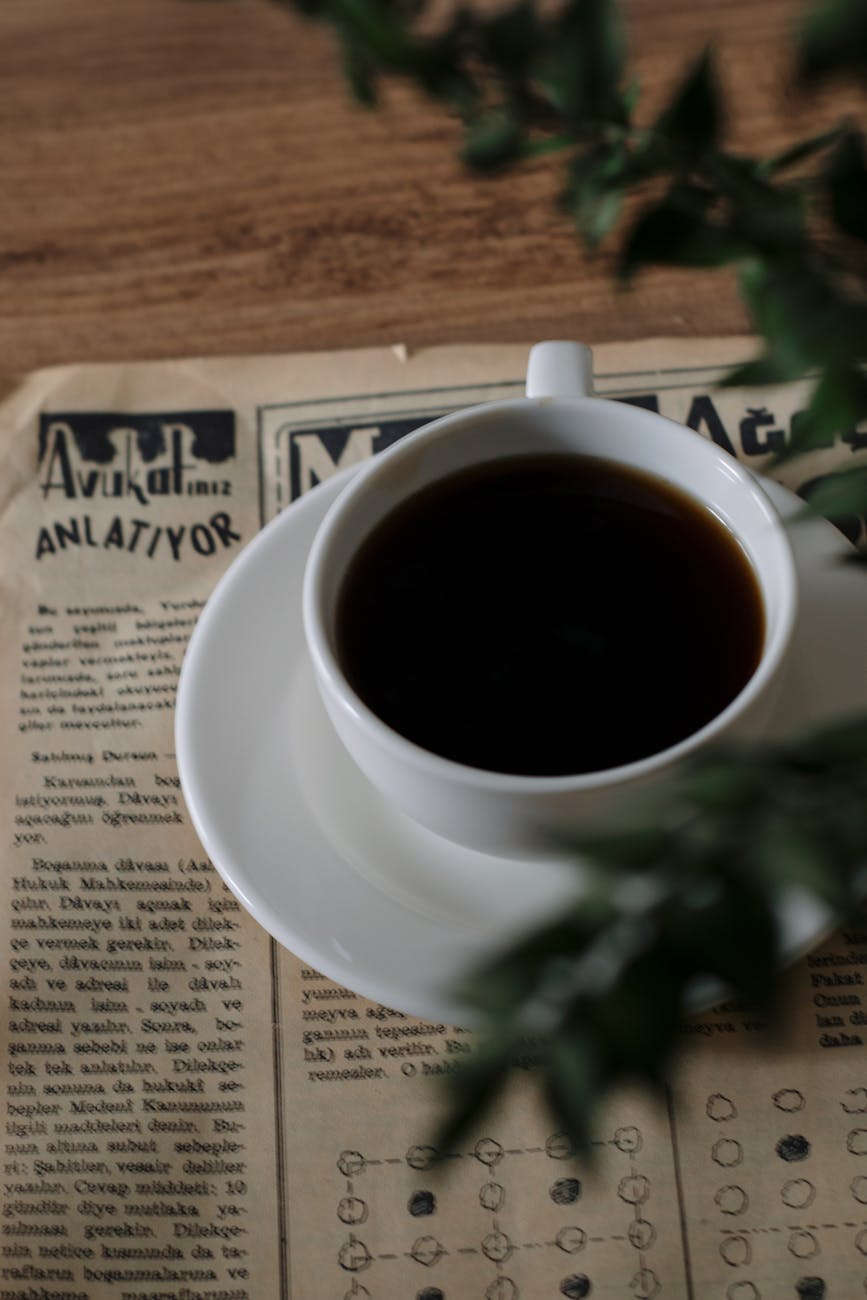 cup of coffee on a vintage newspaper