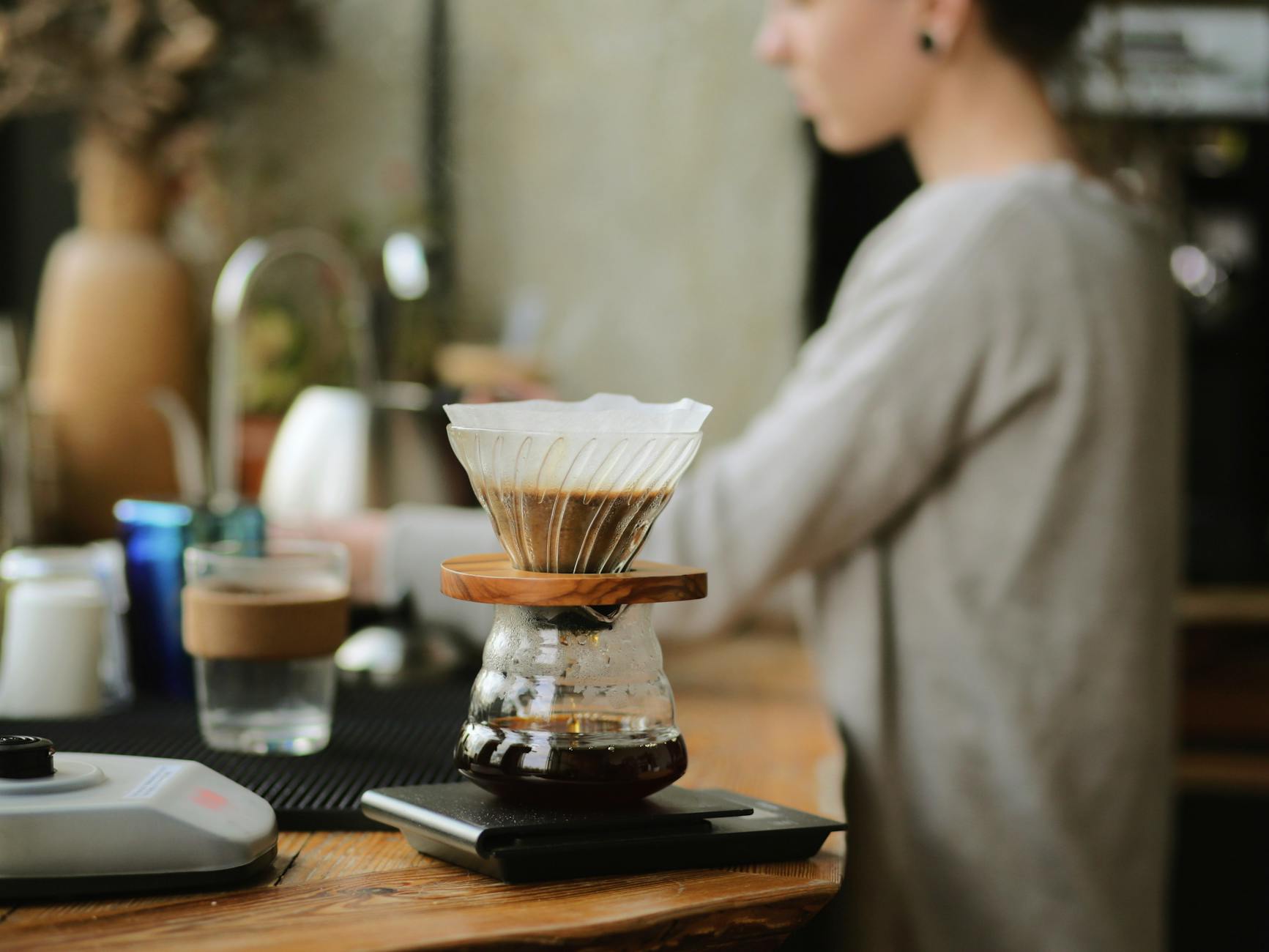 clear glass cup on brown wooden counter top