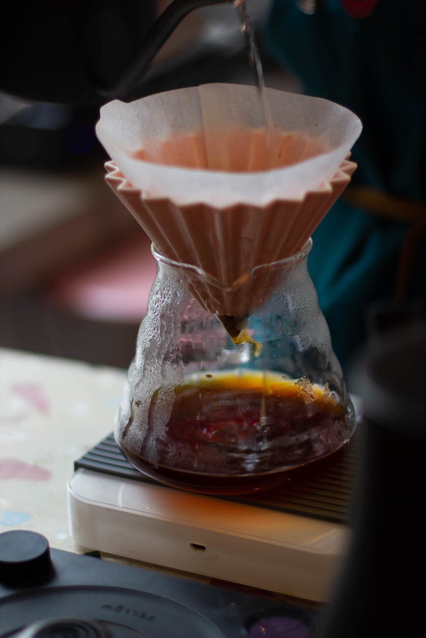 water pouring into filter of chemex